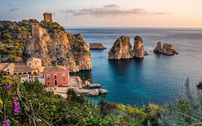 Image of a sun-drenched Mediterranean coastal village